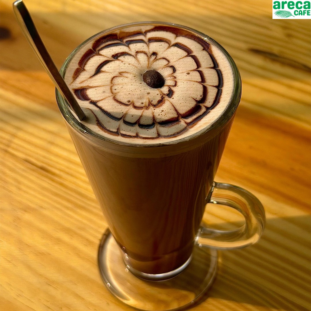 Hot chocolate topped with latte art at Areca Cafe